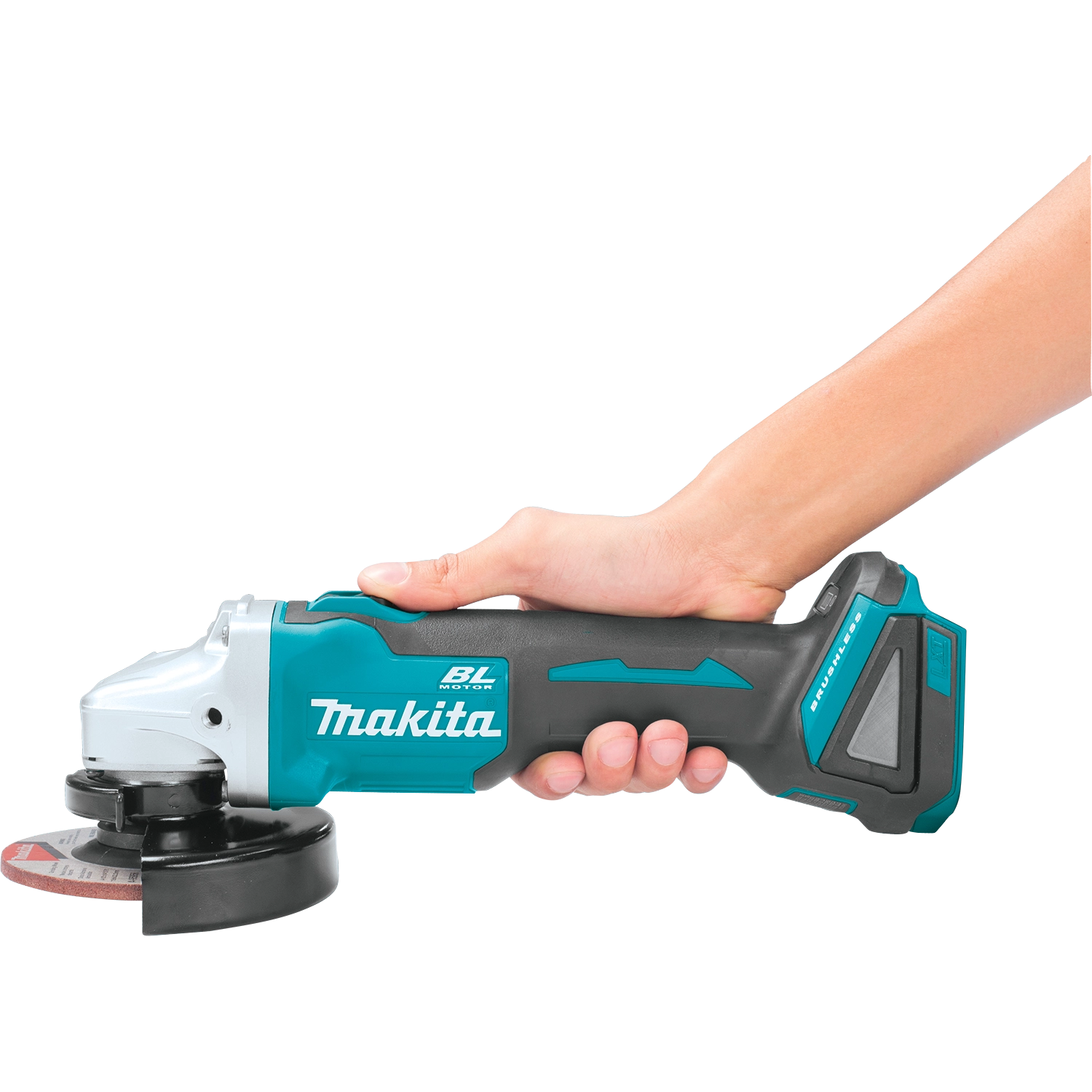 Worker holding side of Makita grinder with firm grip during use
