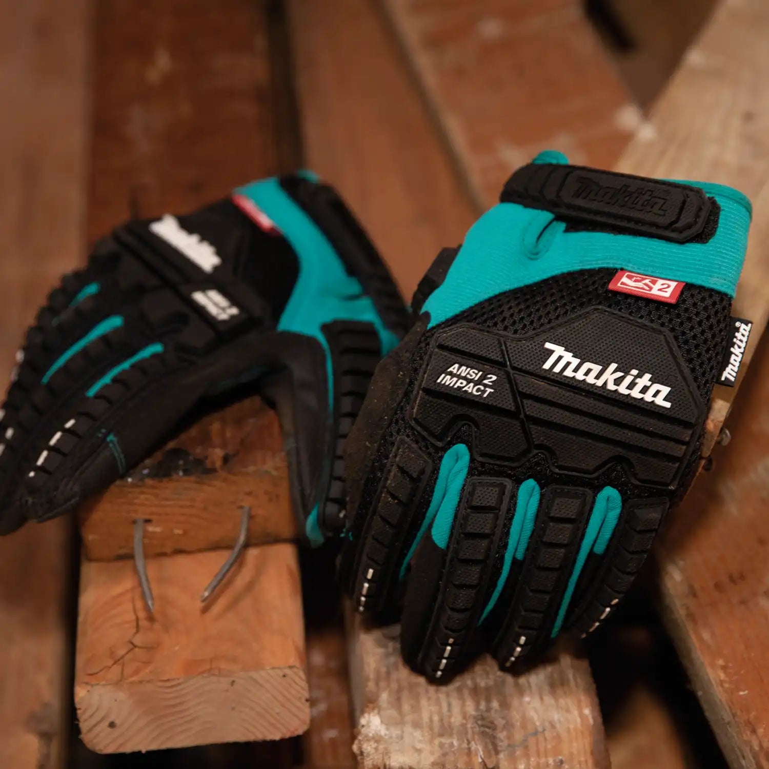 Makita ANSI 2 demolition gloves being worn by worker at active jobsite
