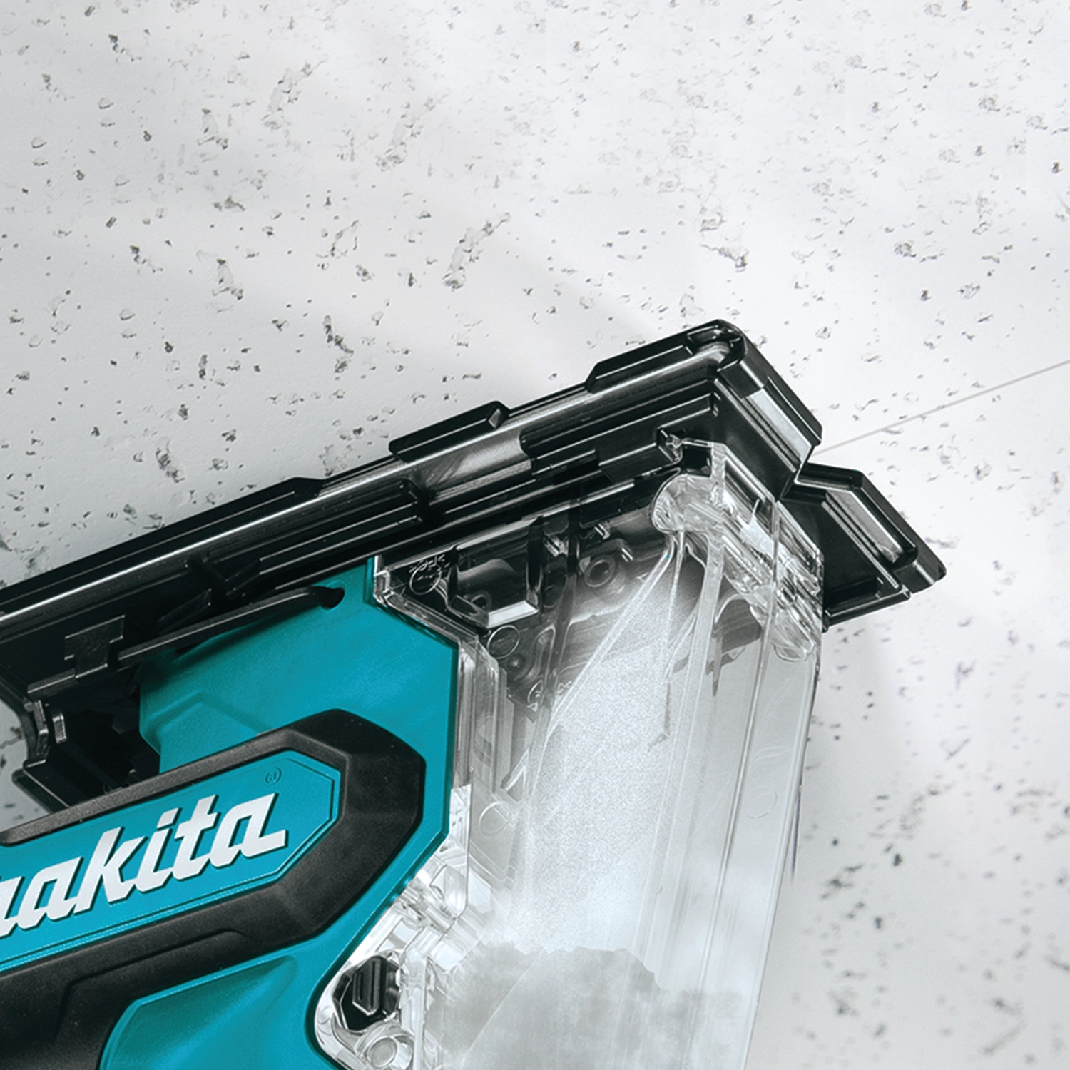 Cutting ceiling drywall with Makita drywall saw overhead
