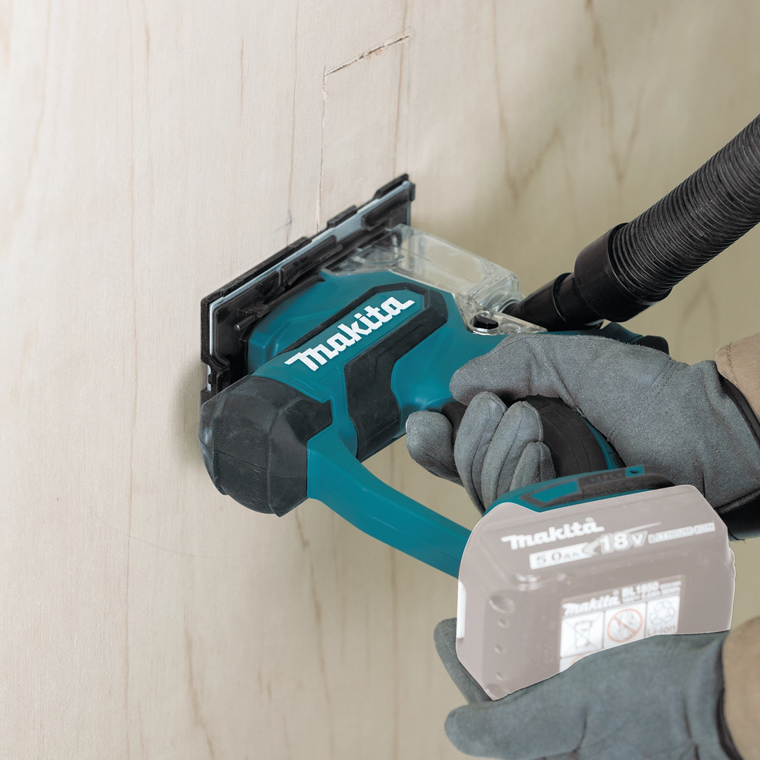 Makita drywall saw cutting through drywall panel
