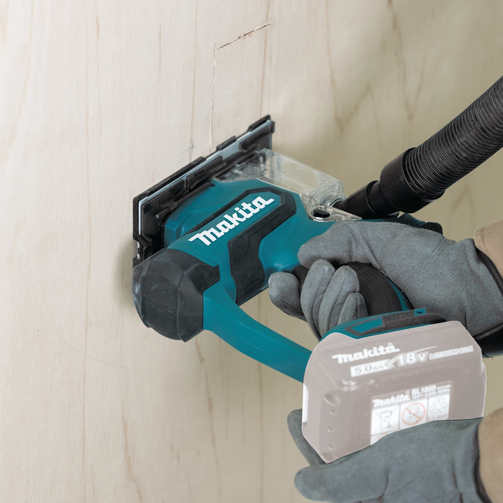 Makita drywall saw cutting through drywall panel
