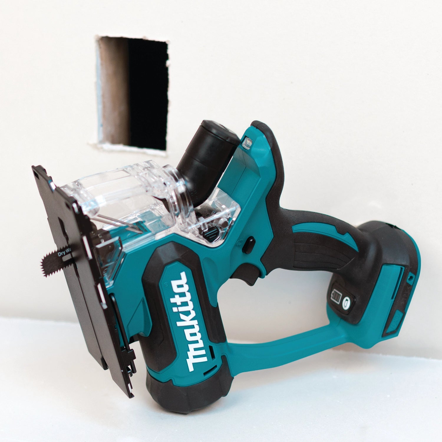 Makita drywall saw sitting idle on jobsite surface
