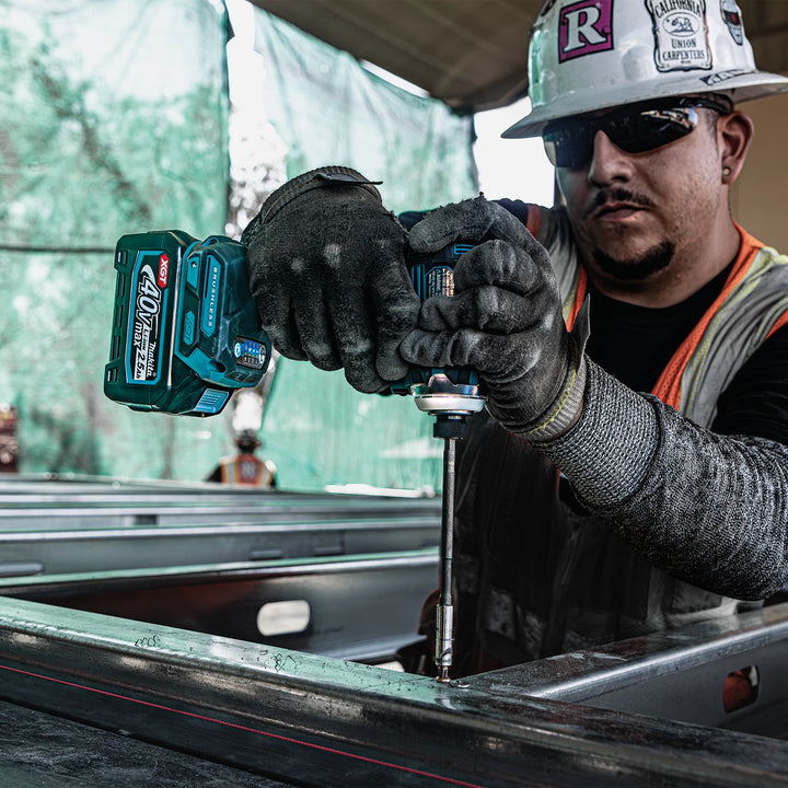 makita gph01 drill used on construction site framing with battery connected
