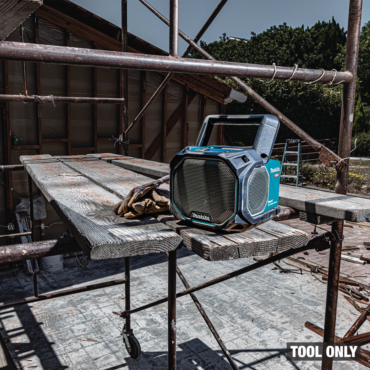 Makita GRM05 on jobsite with handle up for easy transport
