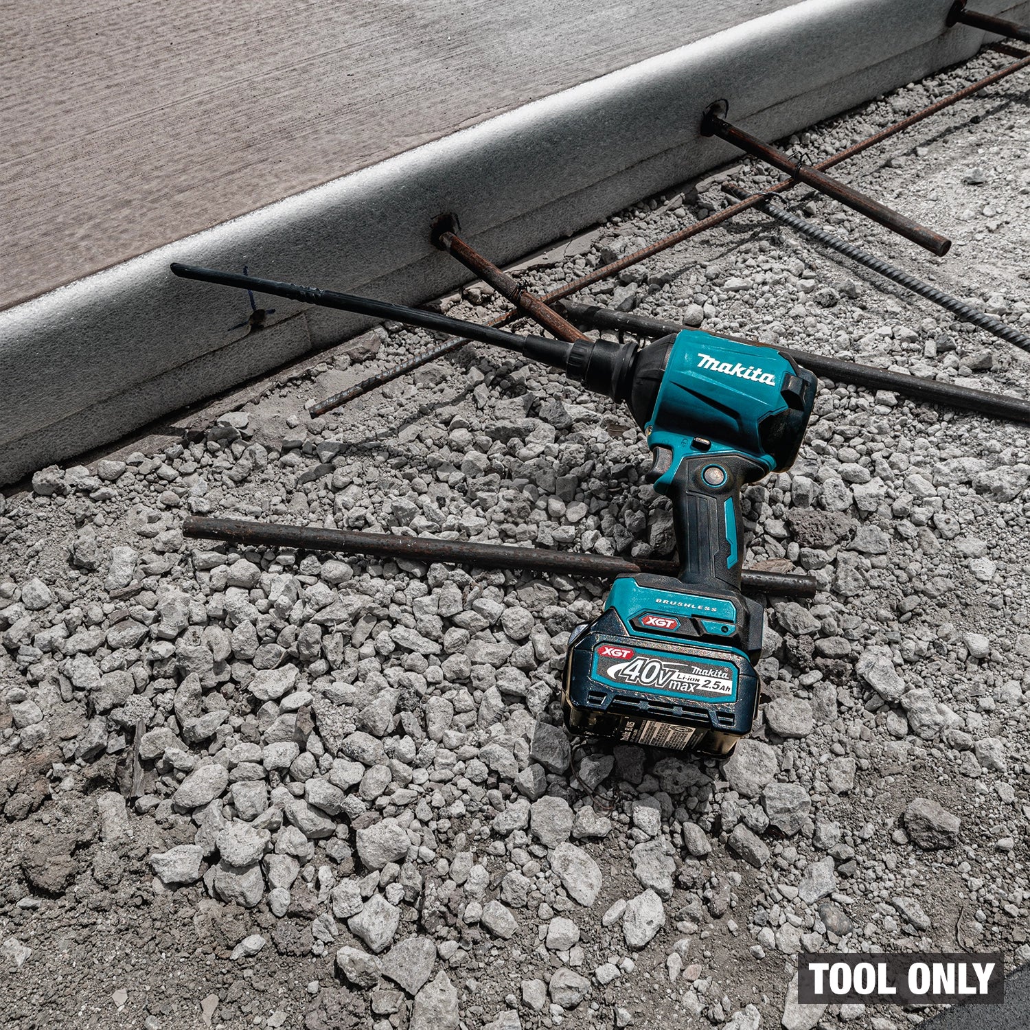 Makita blower in use on jobsite floor for cleanup
