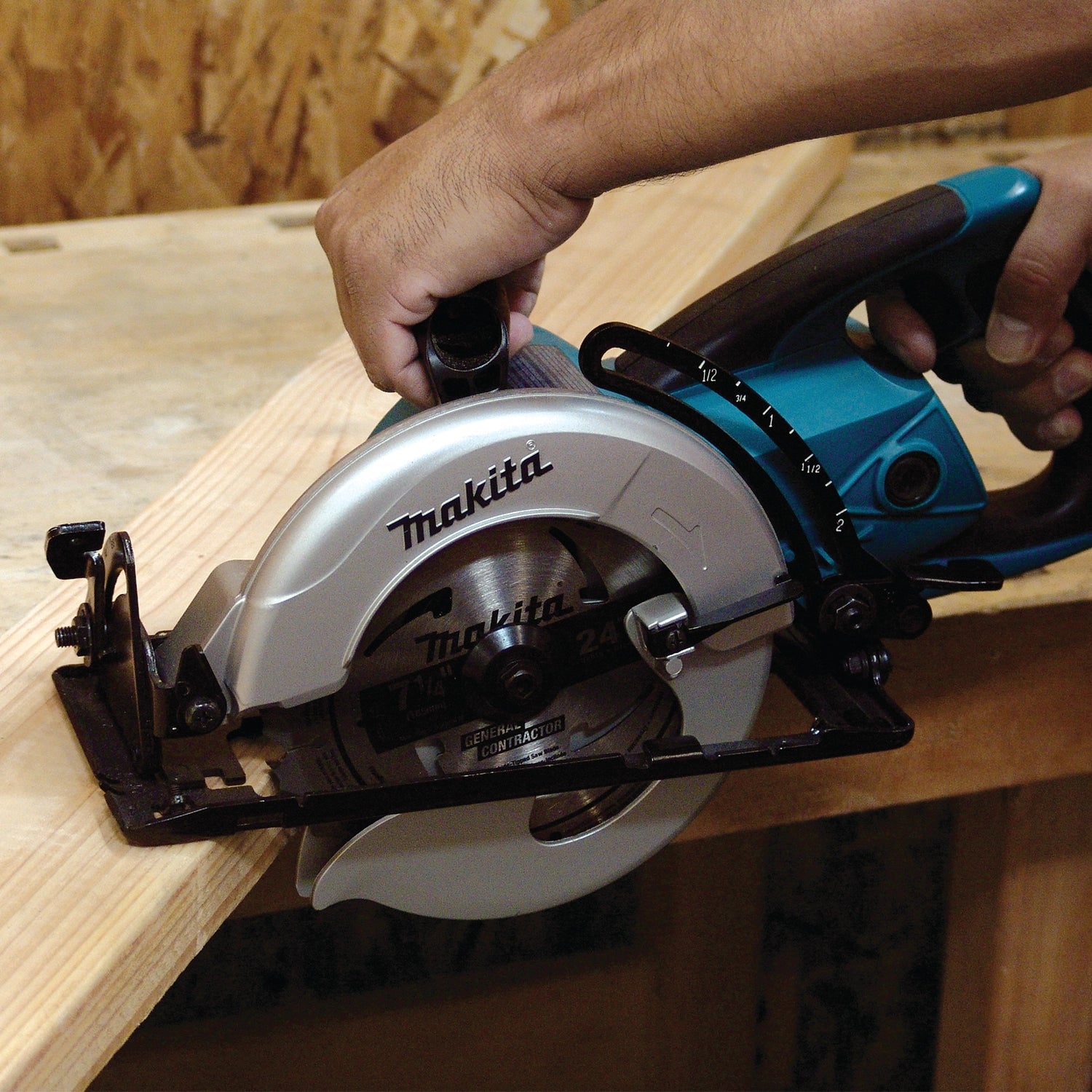 Makita Hypoid Saw in active use mid-cut on job site
