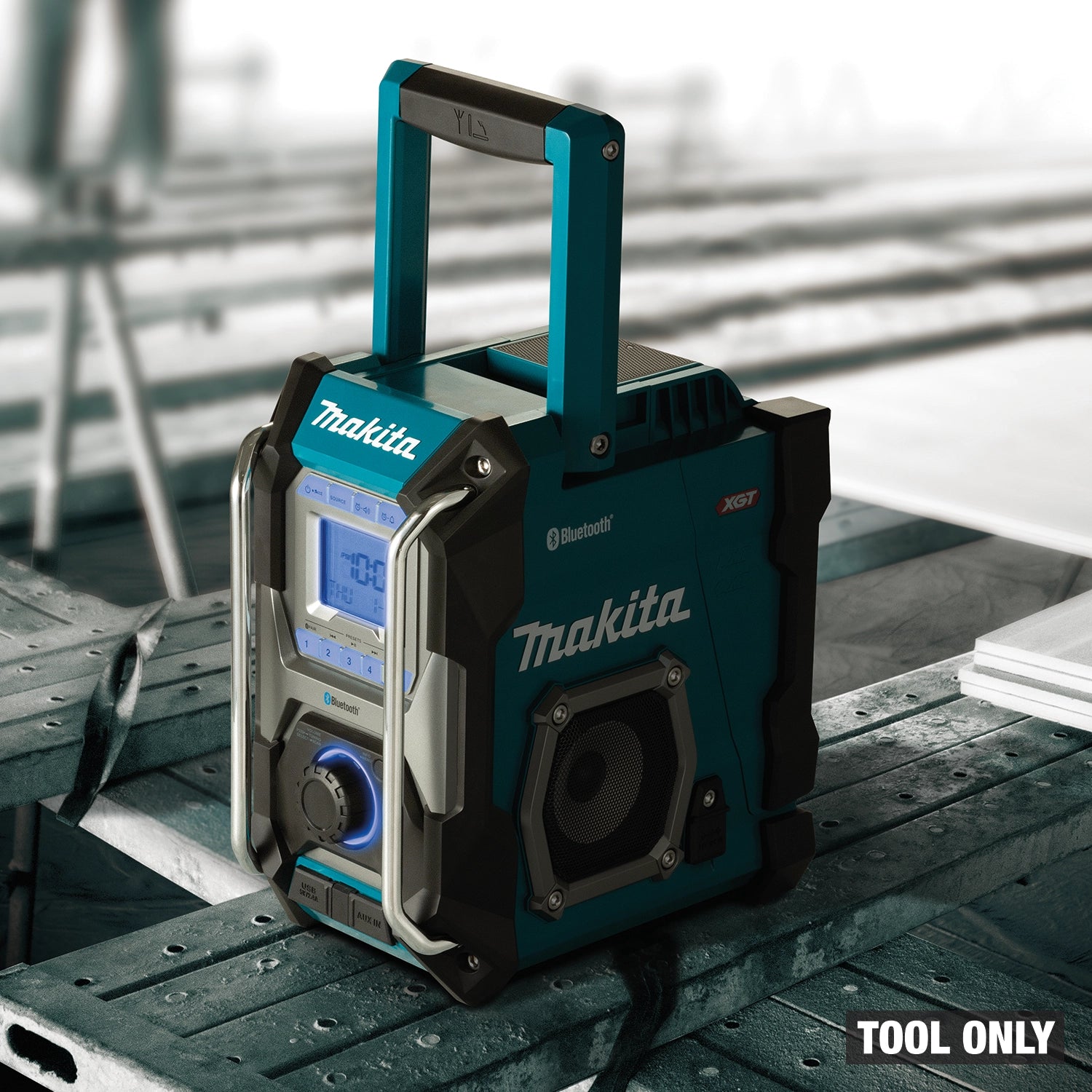 makita 40v xgt job site radio in use at active construction site playing music
