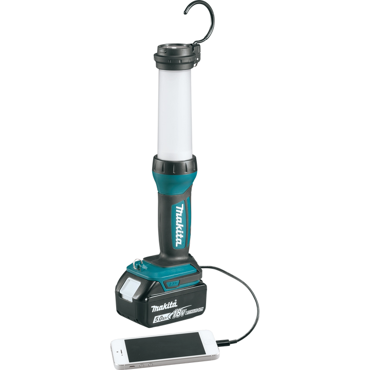 makita led lantern flashlight plugged into phone via usb for charging
