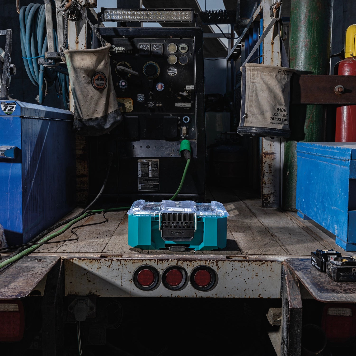 Makita T-90065 laying flat on truck bed with lid closed
