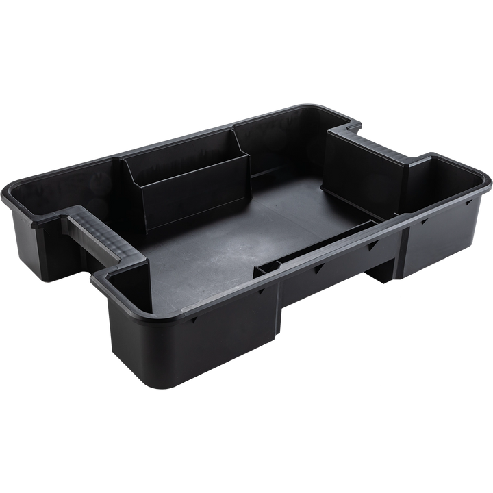 Interior compartment of Makita T-90021 featuring divided tray for battery and charger storage
