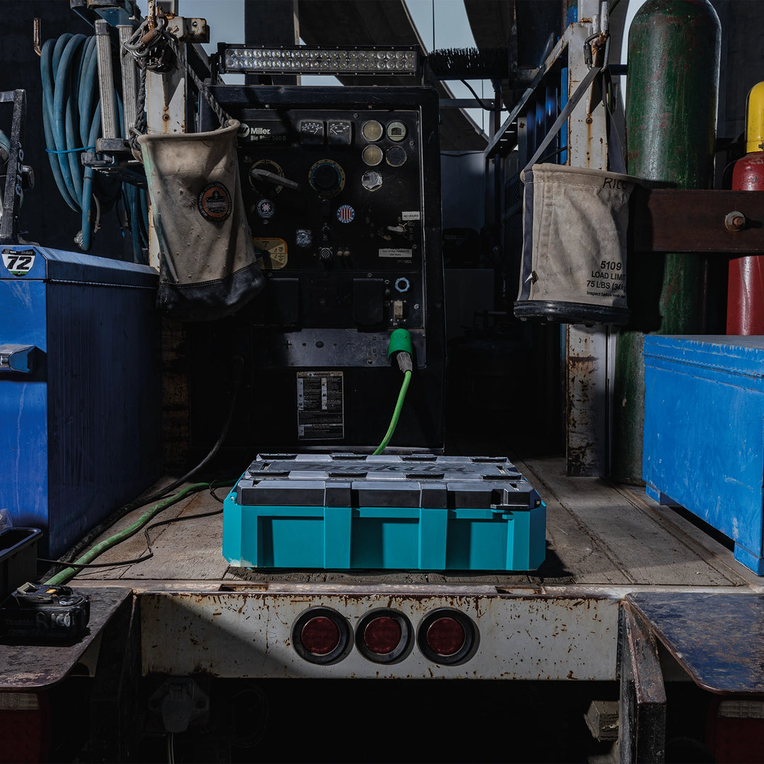 Makita T-90037 medium tool box closed on truck bed workbench
