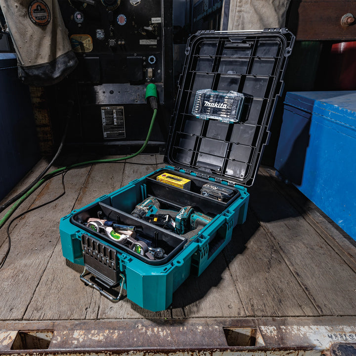 Open Makita T-90037 box on jobsite with power tools stored inside
