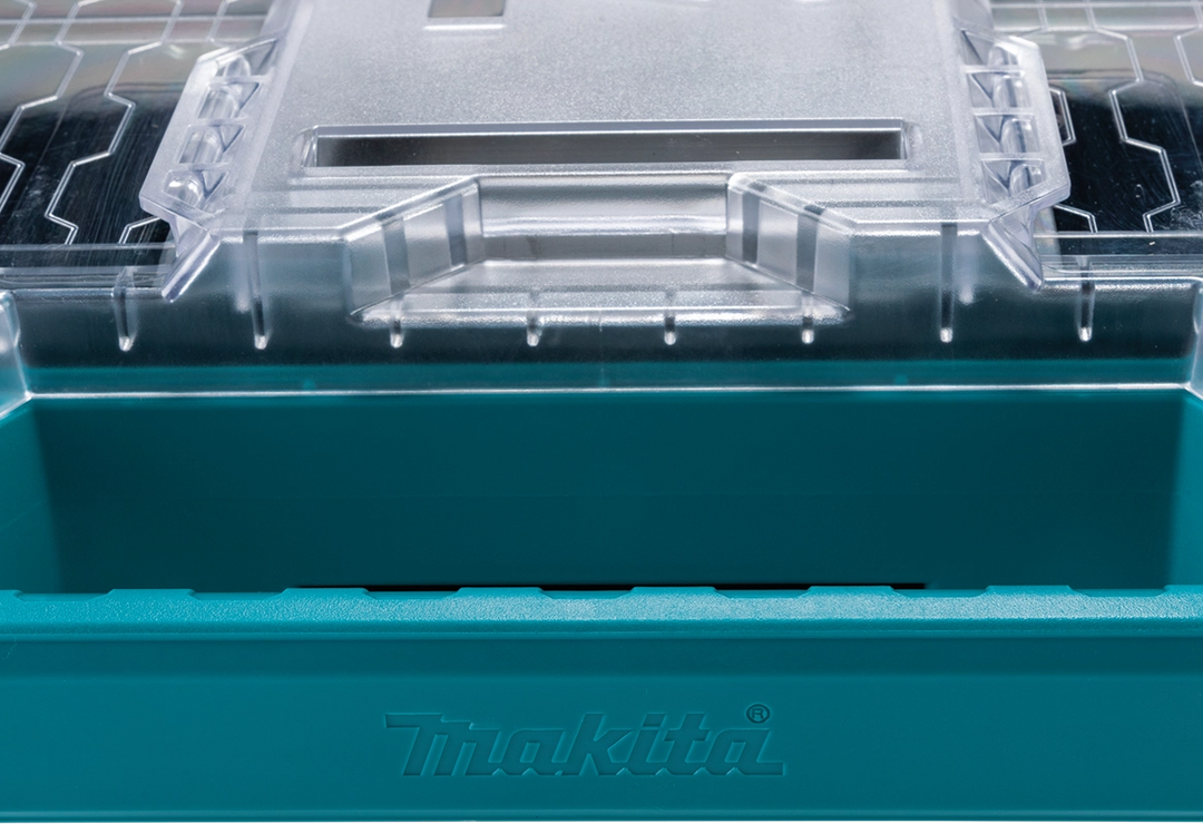 Close-up of the Makita T-90059 MAKTRAK™ Organizer lid showing secure rib design and molded locking channel for bin stability

