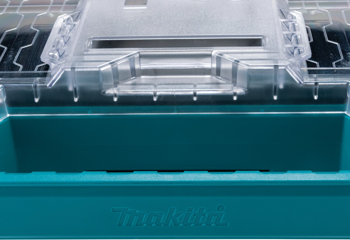 Close-up of the Makita T-90059 MAKTRAK™ Organizer lid showing secure rib design and molded locking channel for bin stability

