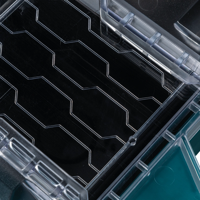 Close-up view of the clear ribbed lid design on the Makita T-90059 Organizer showing internal bin-locking pattern

