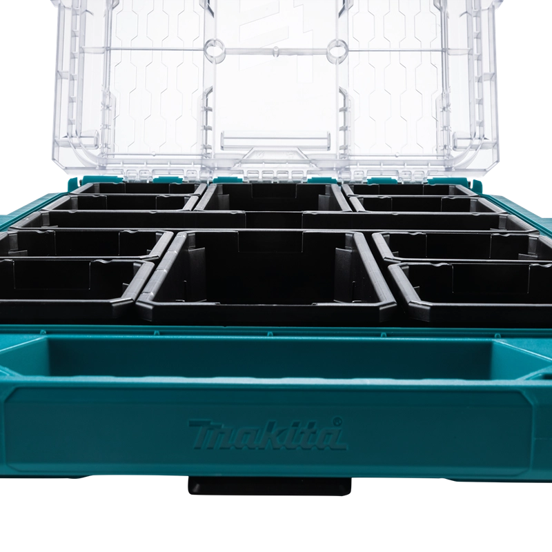 Low-angle front view of Makita T-90059 MAKTRAK Organizer with open lid, showcasing modular bins and embossed Makita logo

