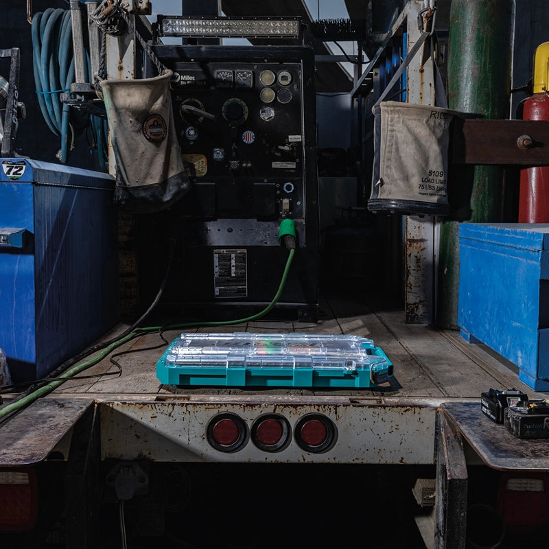 Makita T-90059 MAKTRAK™ organizer closed and placed on the back of a work truck in an industrial jobsite setting.


