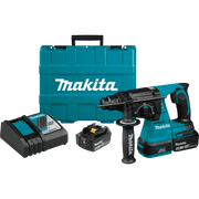 Complete Makita tool kit with tool, batteries, charger, and accessories arranged
