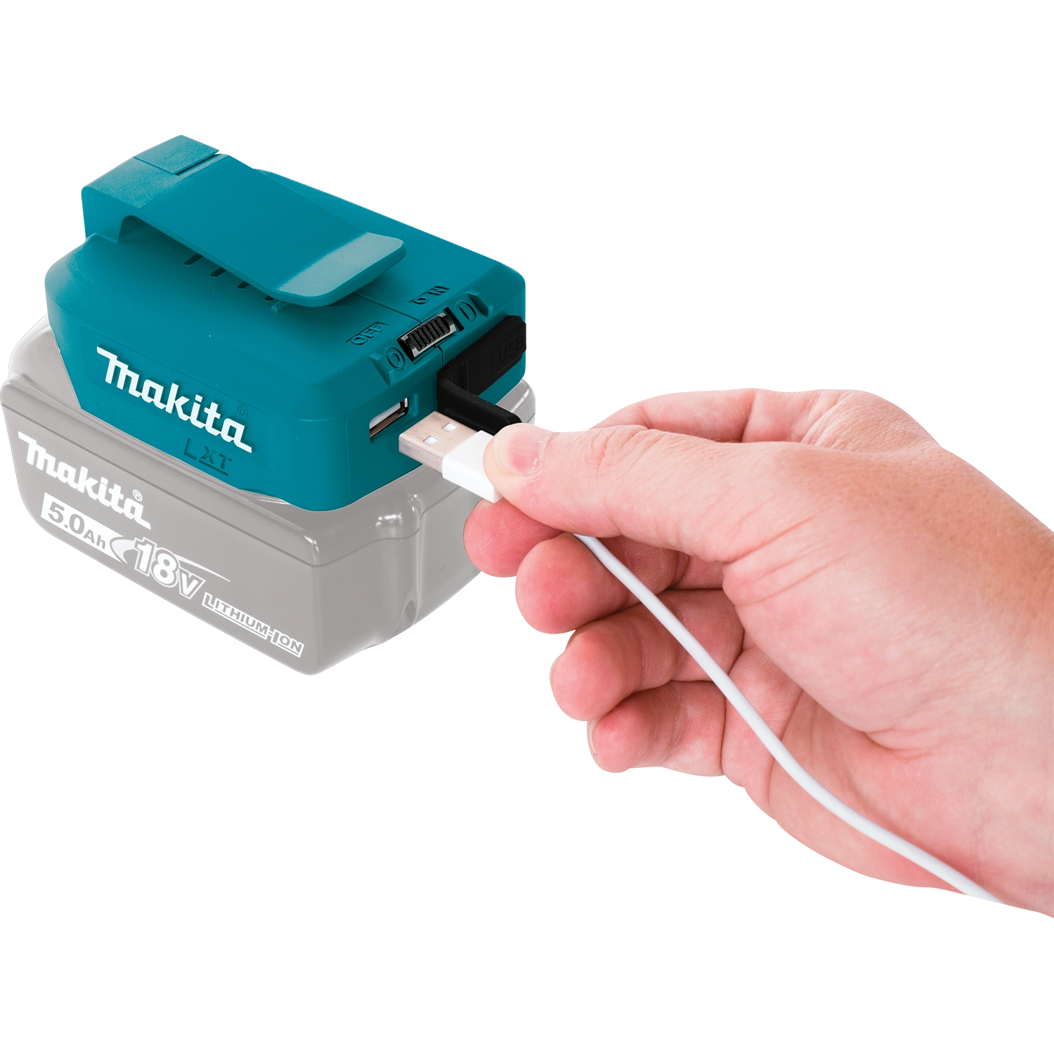 User plugging a phone into the Makita USB power source
