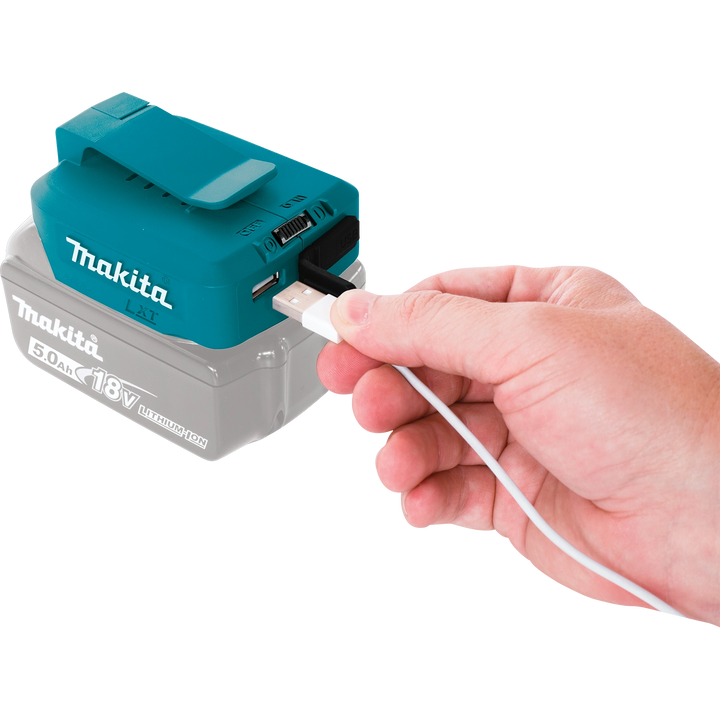 User plugging a phone into the Makita USB power source
