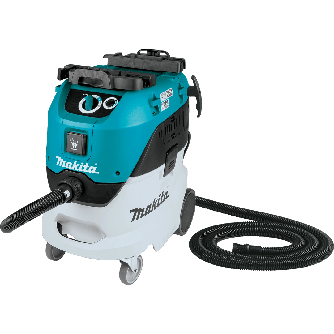 Angled view of Makita VC4210L dust extractor showing hose and controls

