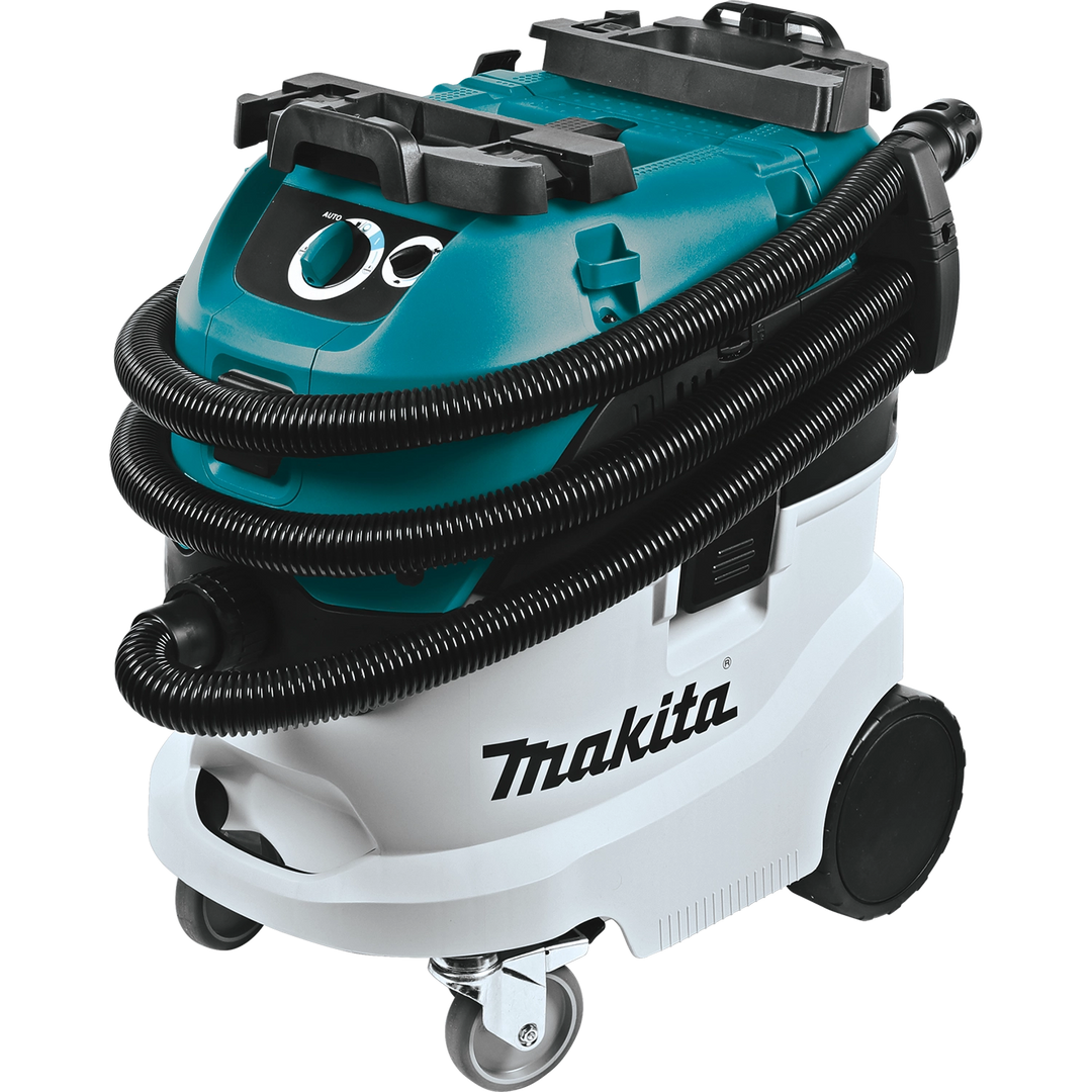Makita VC4210L vacuum with hose wrapped around body showing wide wheels and control dial
