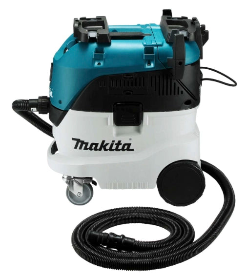 Side view of Makita VC4210L dust extractor with coiled hose


