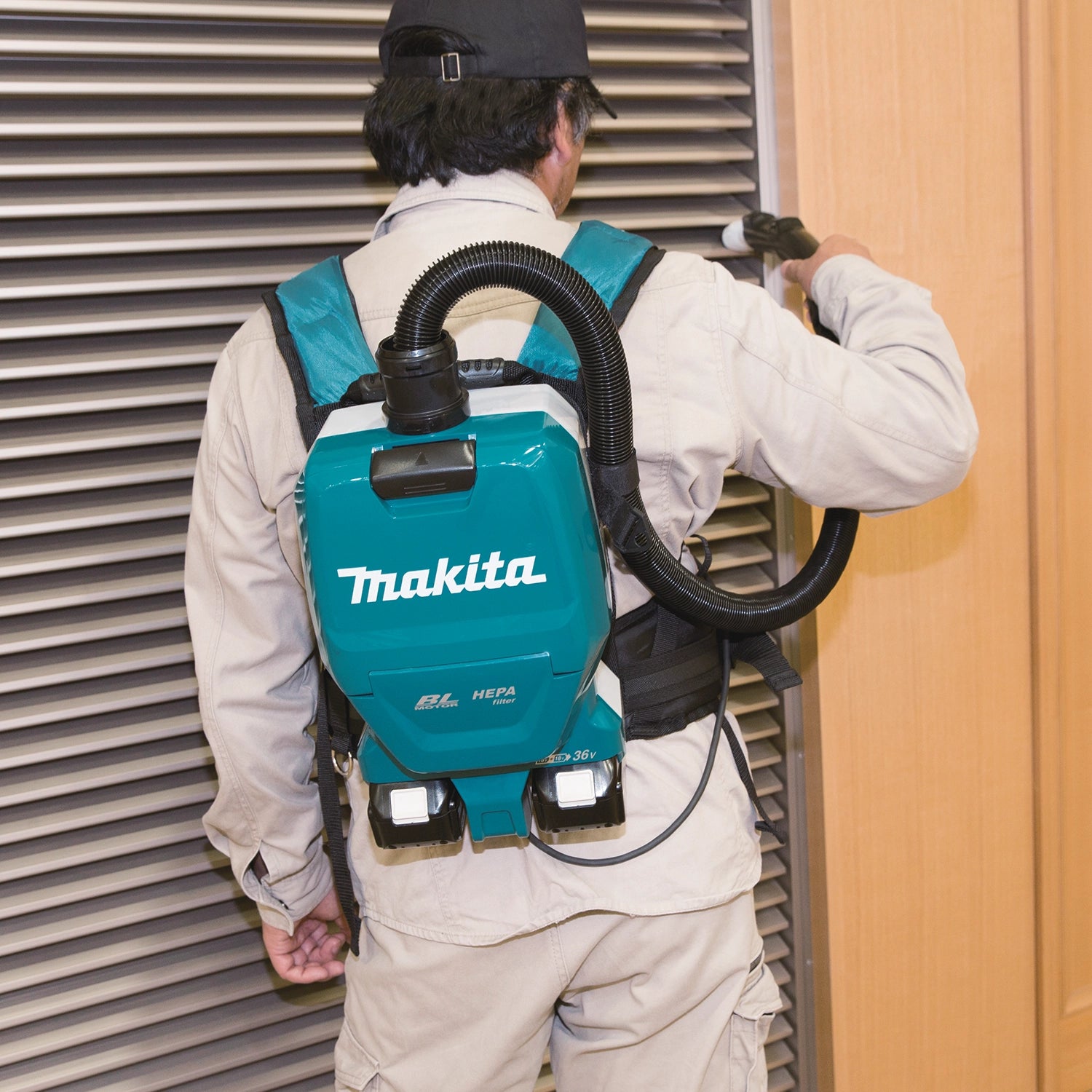 Vacuum used on dusty jobsite near construction materials
