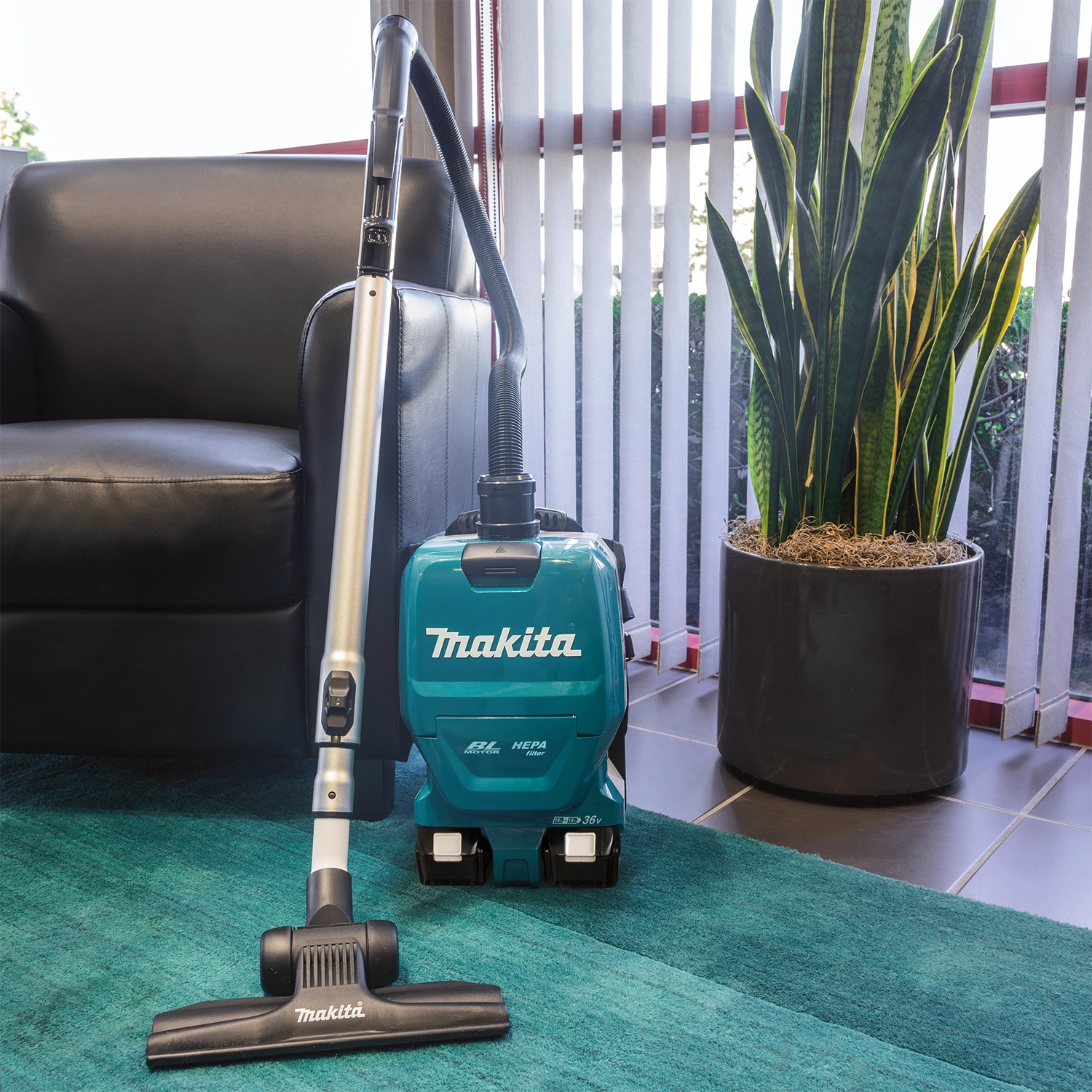 Makita backpack vacuum used on active construction site for debris cleanup
