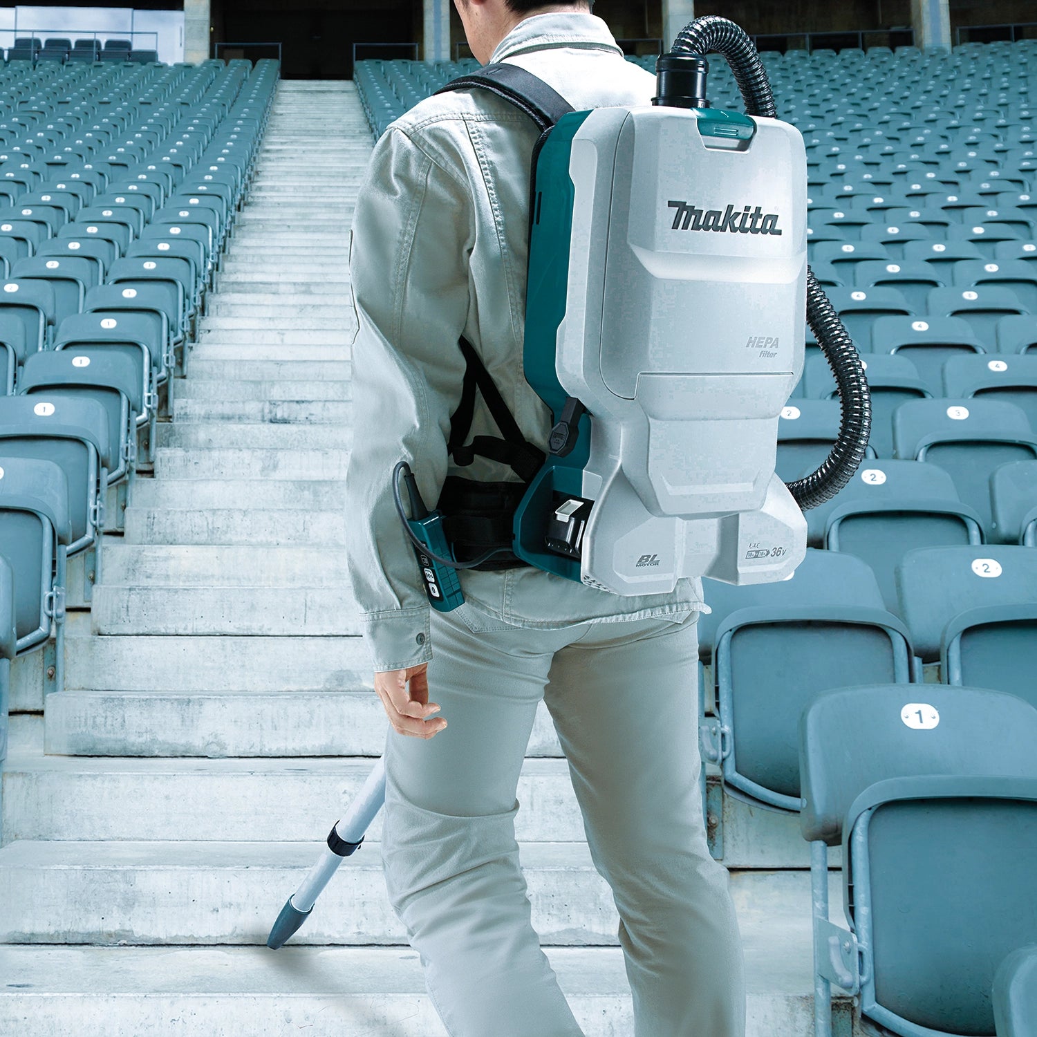 worker wearing makita xcv17pg vacuum cleaning finished interior with low noise output
