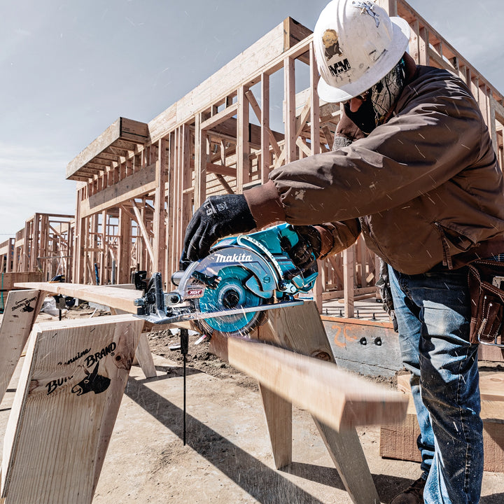 makita 40v max xgt saw placed on job site deck with other tools in background

