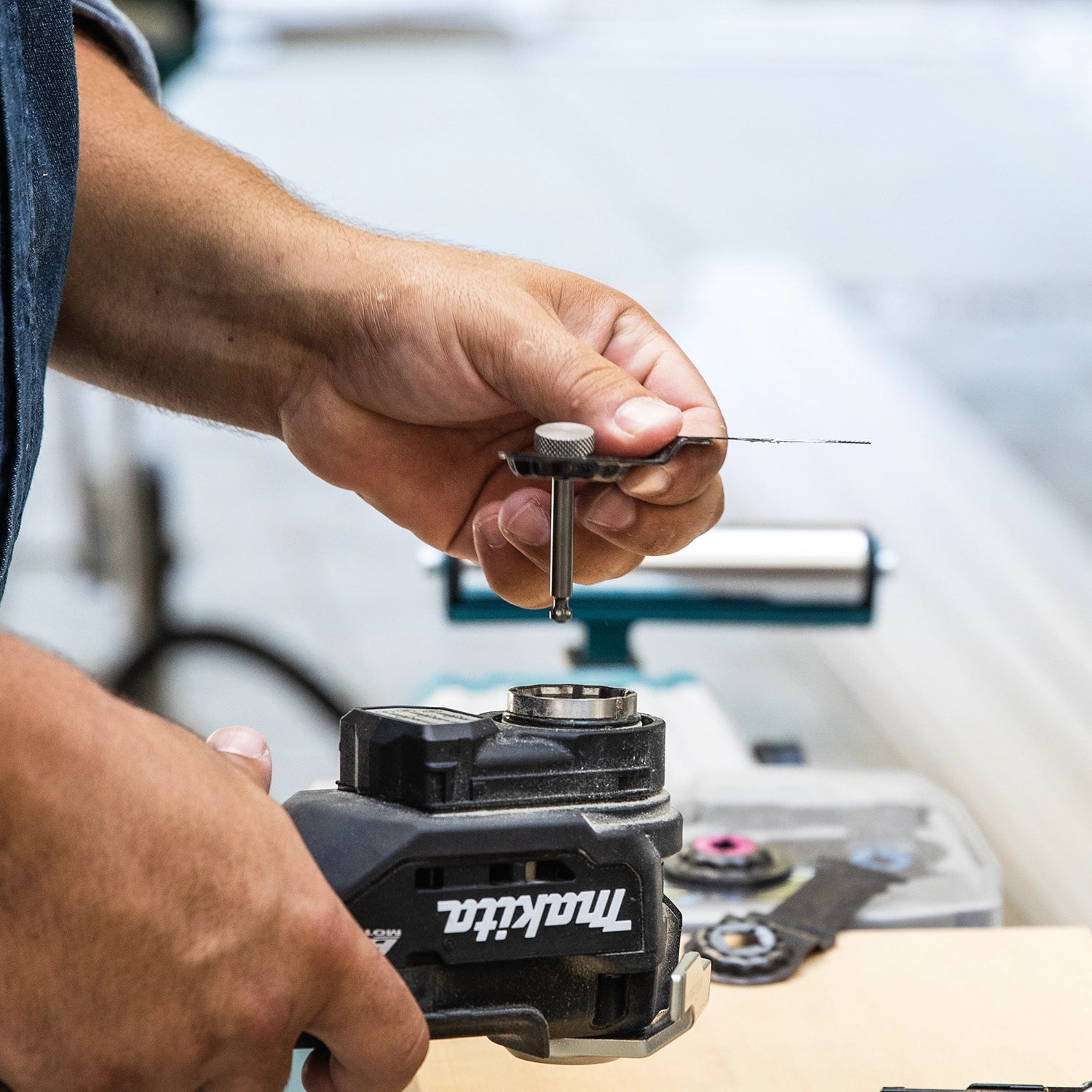 Close-up of blade being installed onto Makita XMT04ZB Starlock interface
