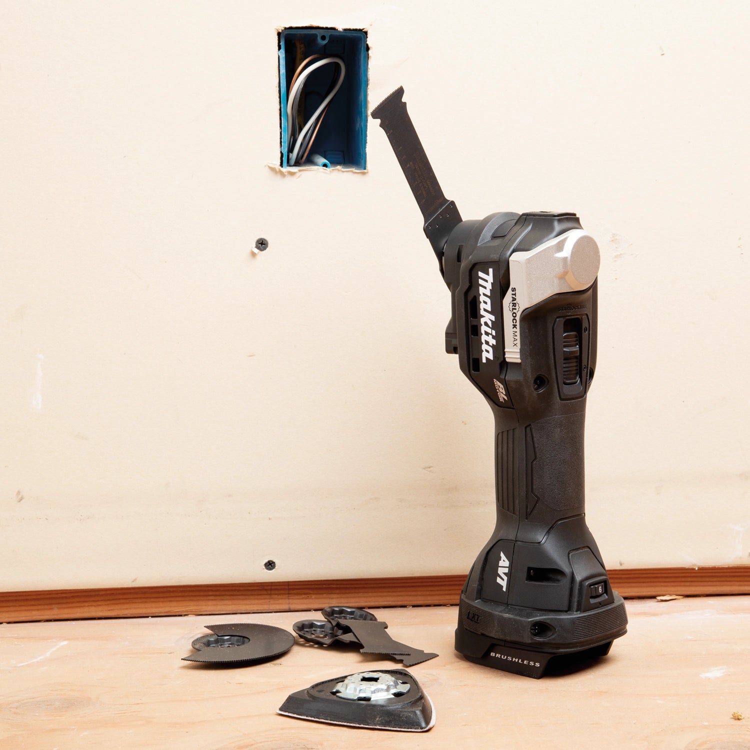 Makita XMT04ZB and accessories on jobsite near power outlet and cutout area
