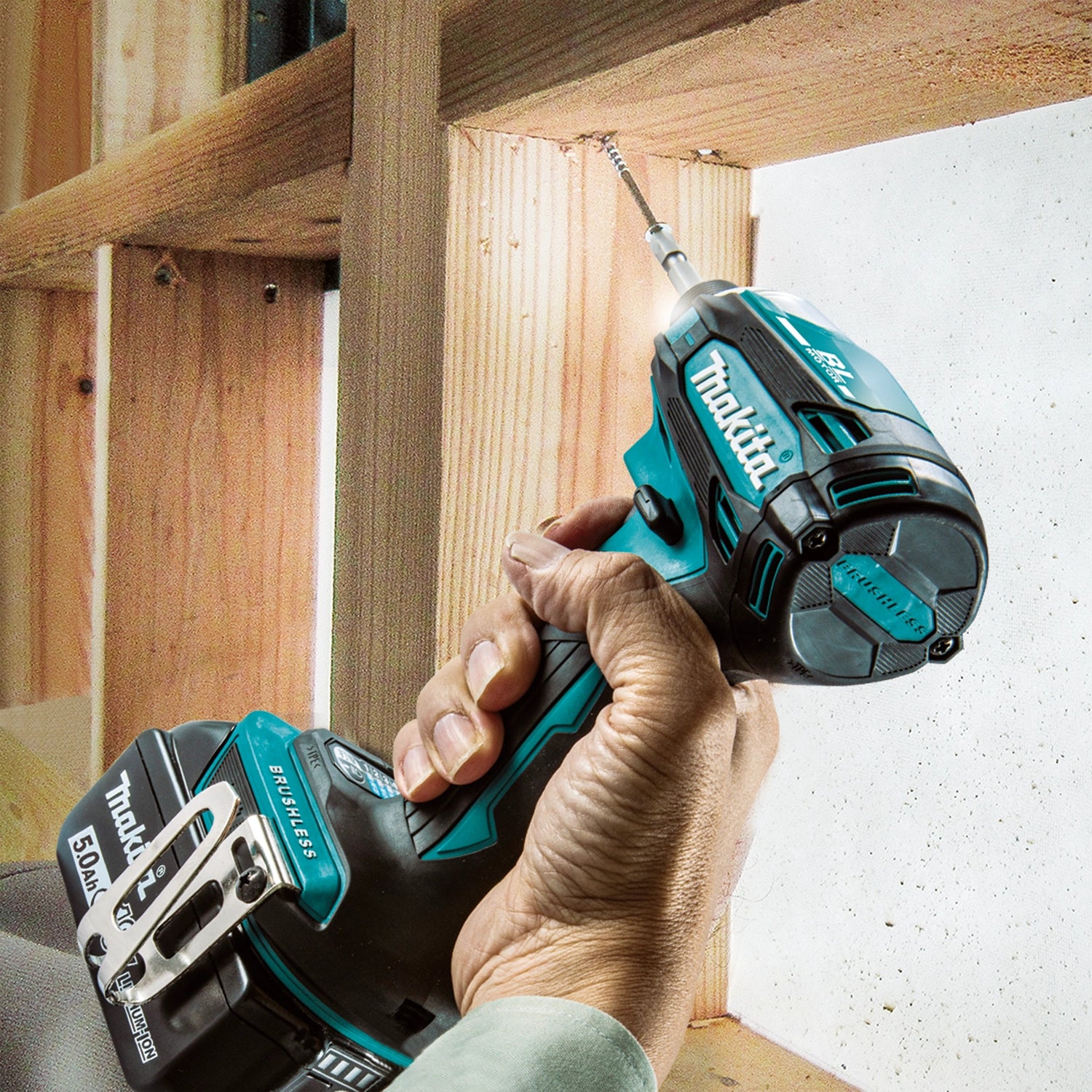 Makita drill working into a tight corner or framing joint
