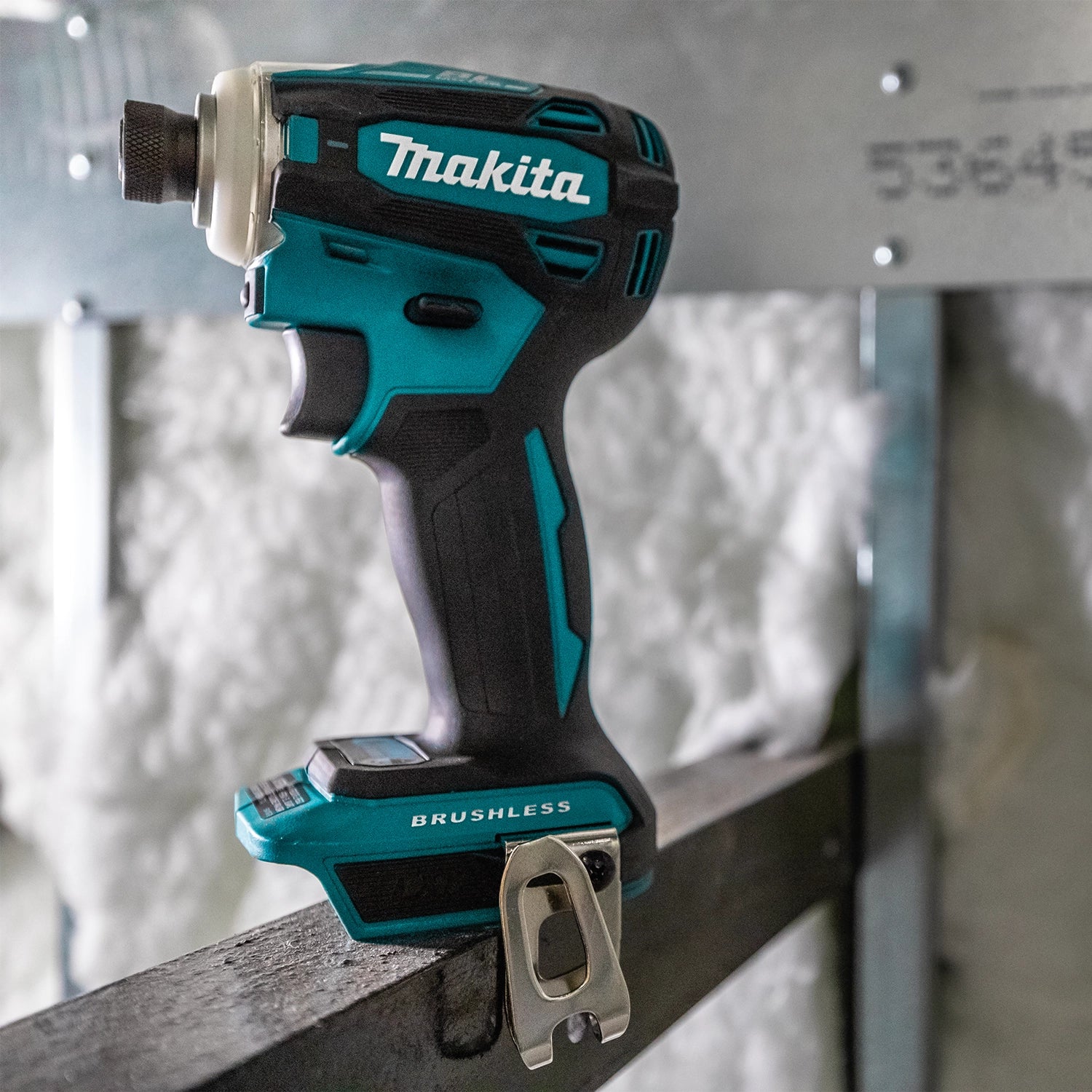 Makita XPH14 drill in use on an active construction jobsite
