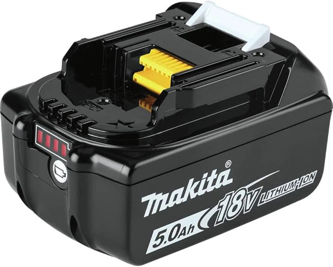 Makita 18V 5.0Ah LXT battery placed next to XT291T impact driver on jobsite surface
