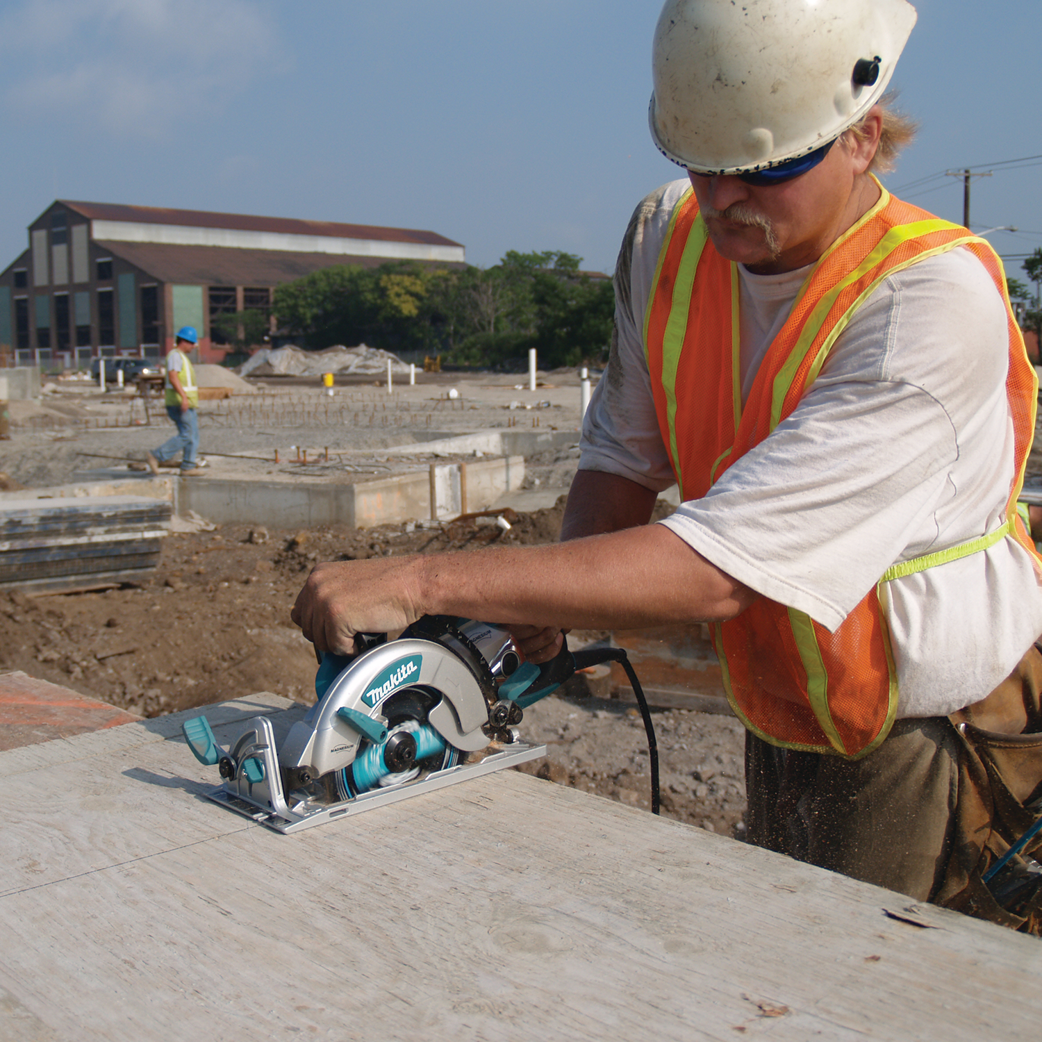 Multiple Makita Hypoid Saws in use across job site tasks
