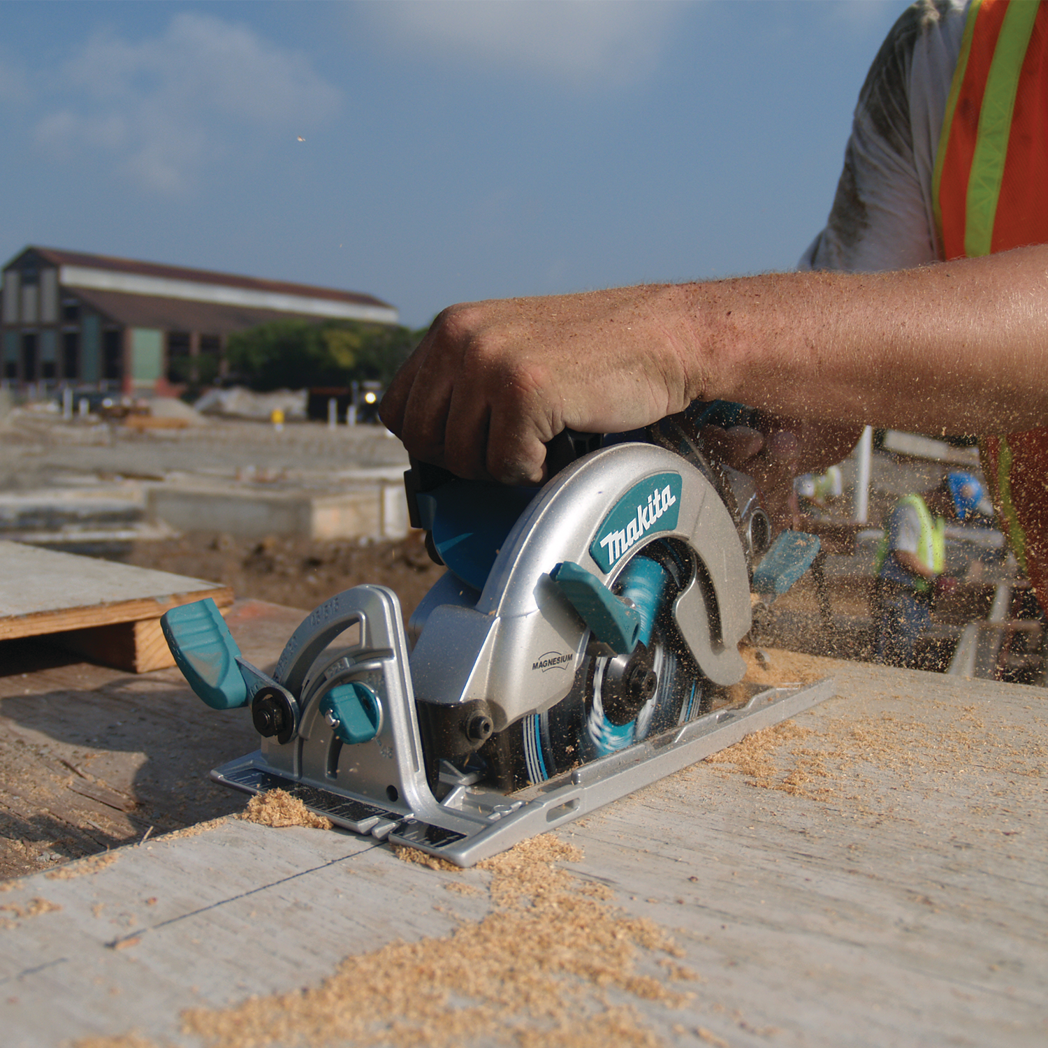 Close-up of sawdust discharge during cut with Makita Hypoid Saw
