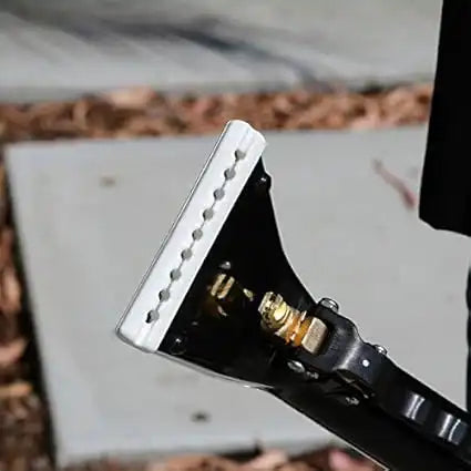 Close-up view of Mytee 8400P Upholstery Tool nozzle and spray jet assembly during outdoor use
