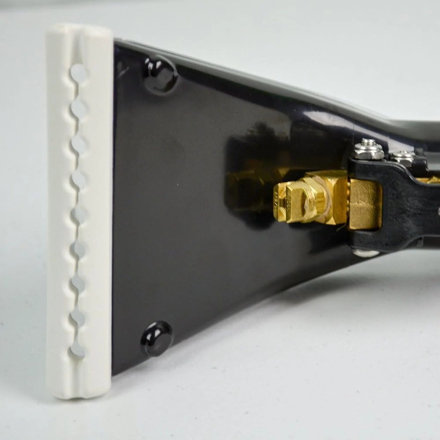 Close-up view of Mytee 8400P Upholstery Tool spray nozzle and vacuum slot showing brass fittings and clear extraction head