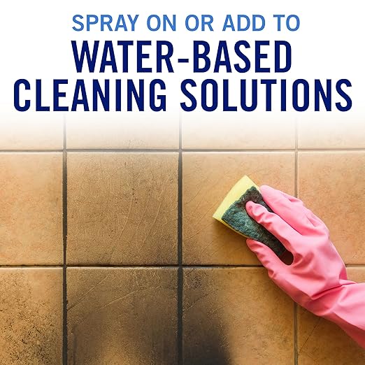 Pouring OdorX 9D9 into water-based cleaning solution
