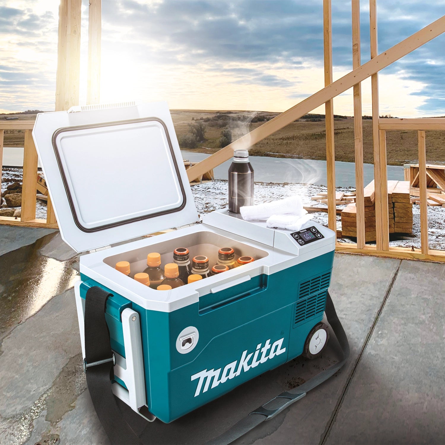 makita cooler warmer box placed on grass during outdoor job or recreational activity
