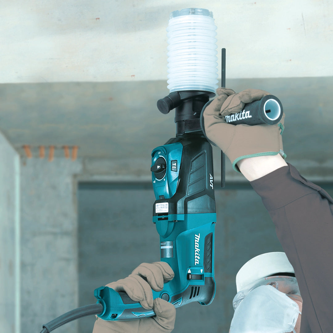 makita dust extraction cup in use on jobsite while drilling overhead
