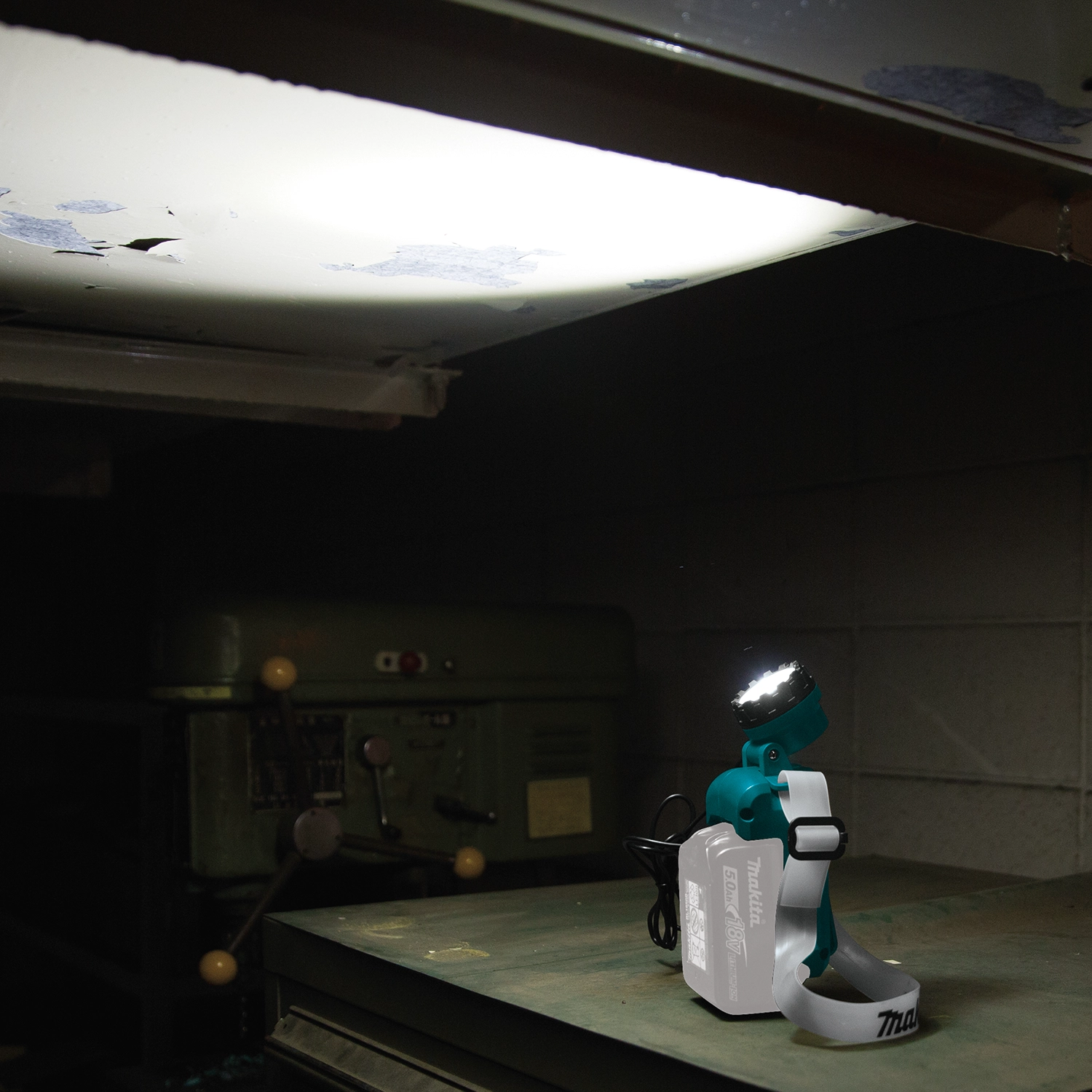 makita led headlamp in use on job site during electrical or plumbing work
