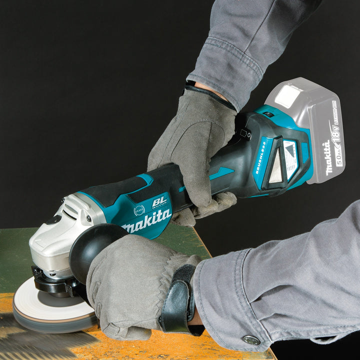 makita grinder in use on job site cutting metal pipe
