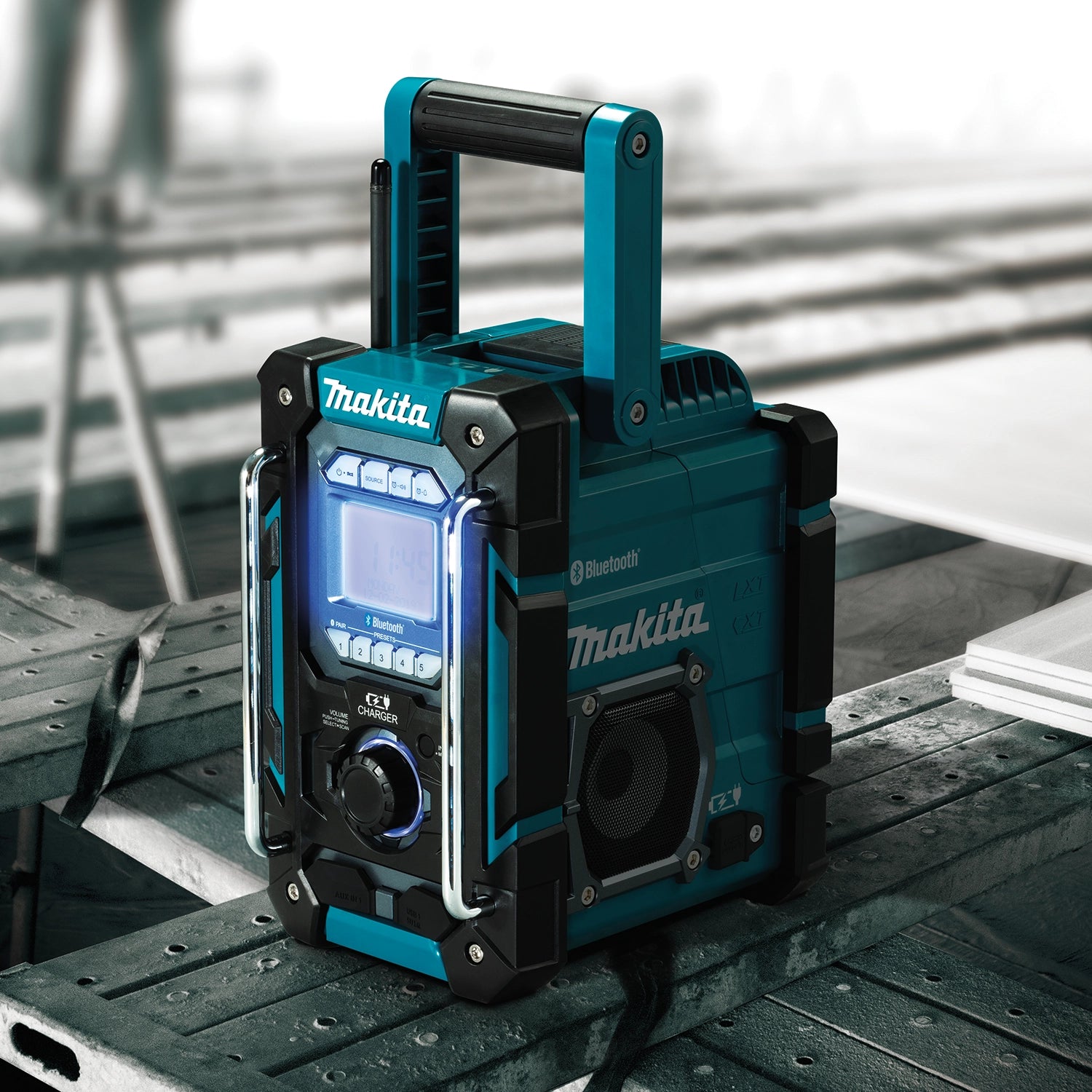 makita 18v lxt radio charger placed on scaffolding during job site operation
