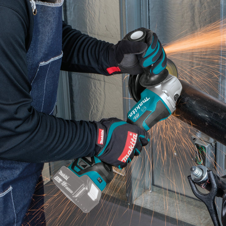 makita grinder used overhead on steel framing during construction
