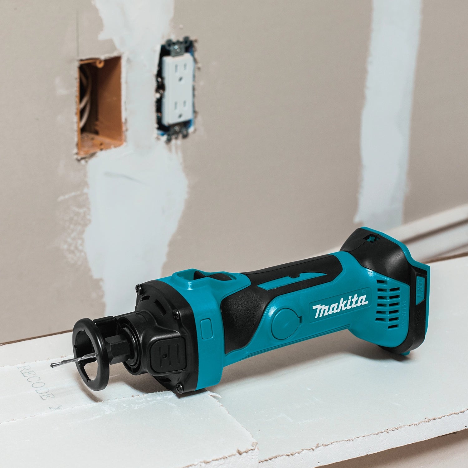 makita 18v lxt cut-out tool in use on job site during remodeling project
