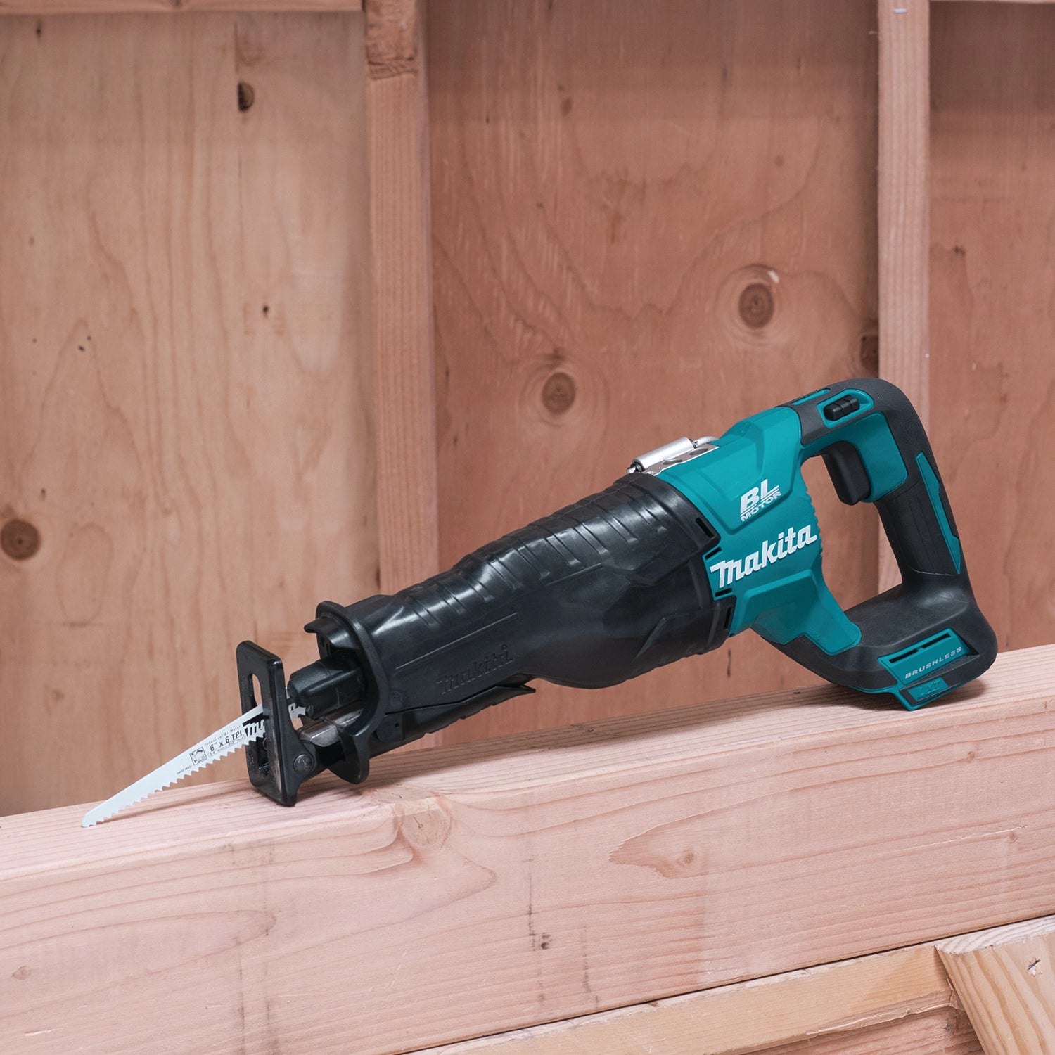 makita 18v lxt reciprocating saw positioned at job site with tools
