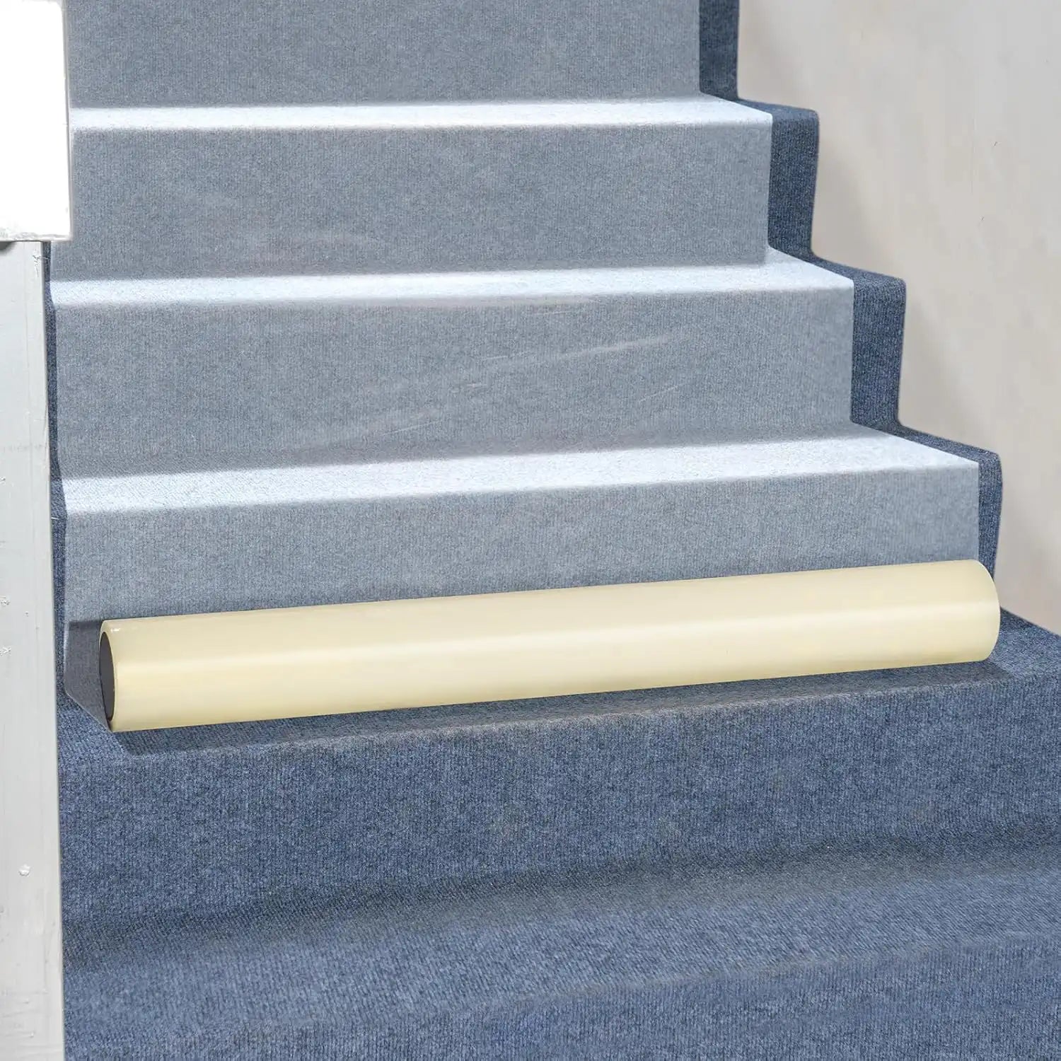 Presto 36" carpet protector applied to carpeted stairway for safe, temporary coverage
